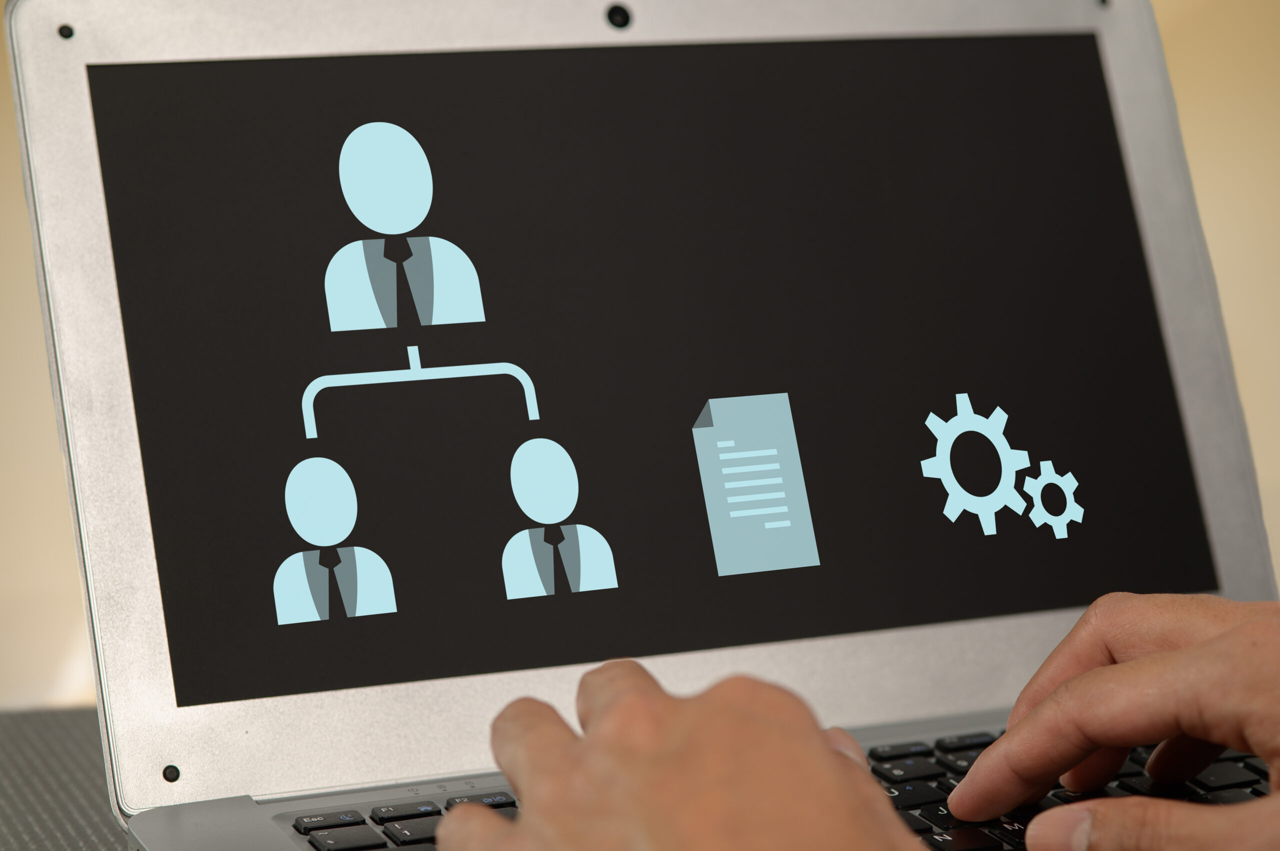 Illustration of business workflow and collaboration displayed on a laptop screen. This image highlights technology integration and teamwork in a corporate setting.