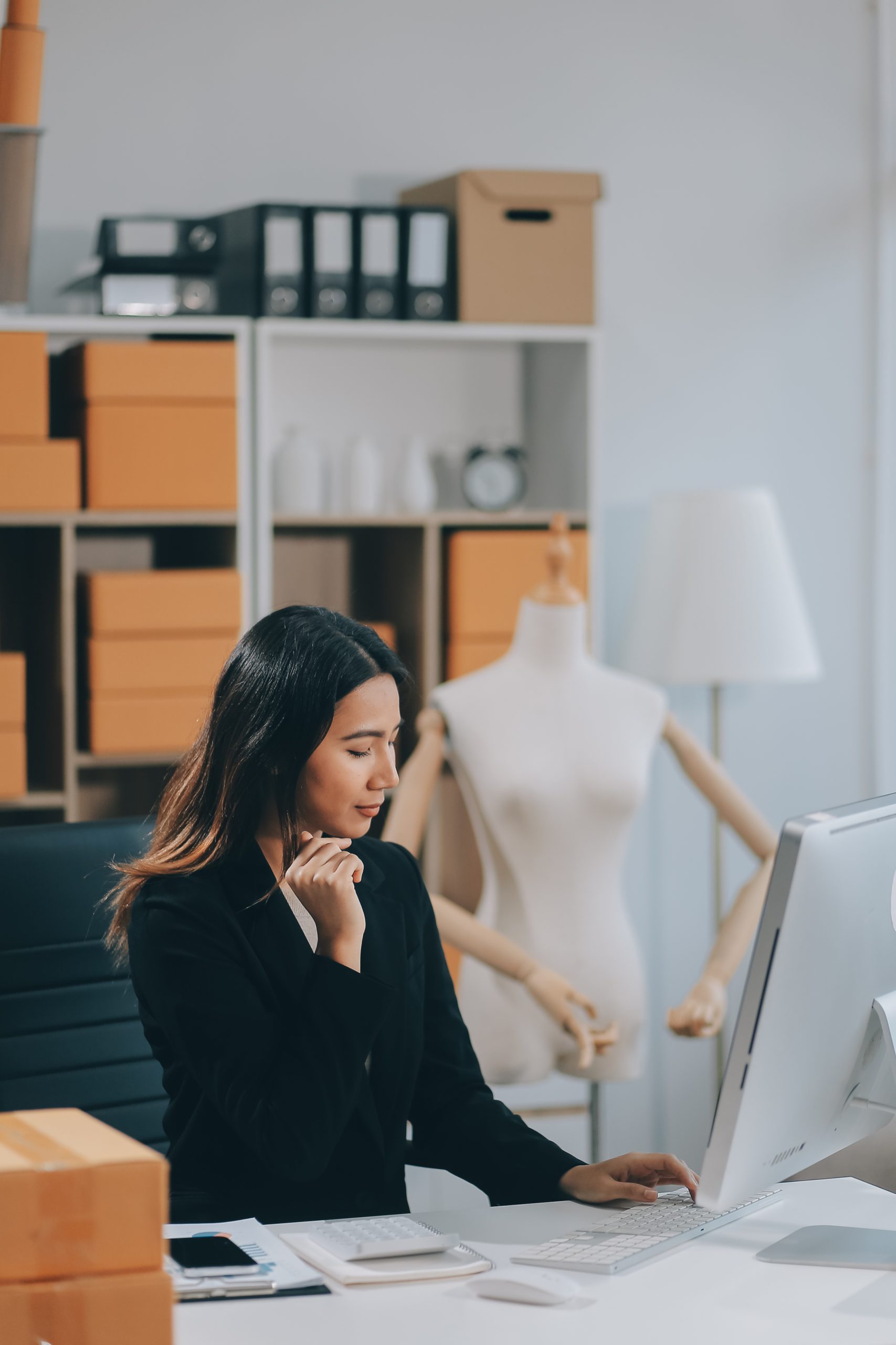 Successful Woman start up online seller at workplace. small business entrepreneur SME or freelance asian woman working with box at home.